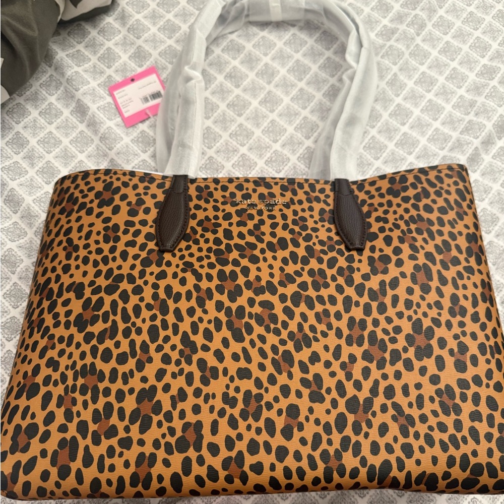 Kate Spade leopard toe with inside wallet.